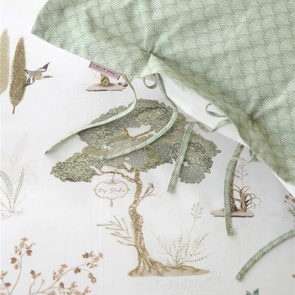 PIP Studio Giardini di Frutta White Cotton Quilt Cover Set featuring palm and fruit tree designs, with a luxurious stitched Oxford border.