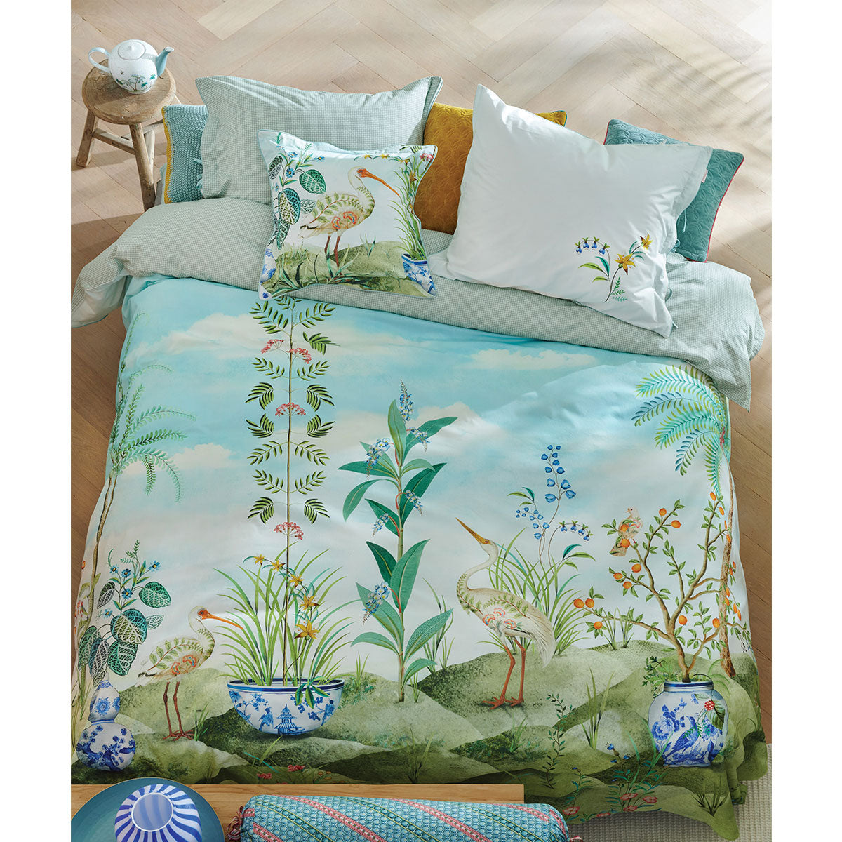 PIP Studio Jolie White Cotton Quilt Cover Set featuring a vibrant landscape print with palm trees and elegant herons.