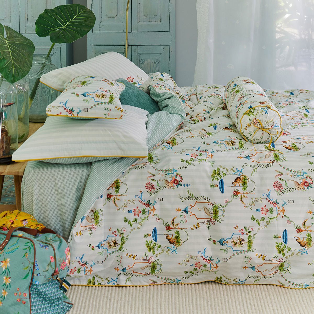 PIP Studio Singerie White Cotton Quilt Cover Set featuring vibrant bird and monkey designs on a white background with decorative floral elements.