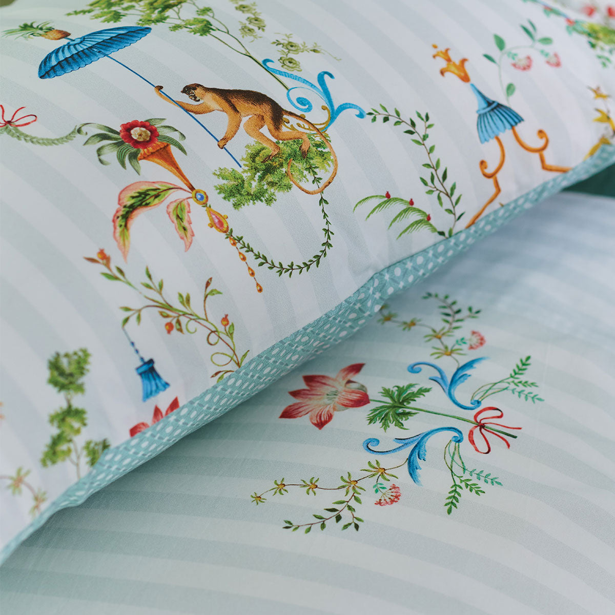 PIP Studio Singerie White Cotton Quilt Cover Set featuring vibrant bird and monkey designs on a white background with decorative floral elements.