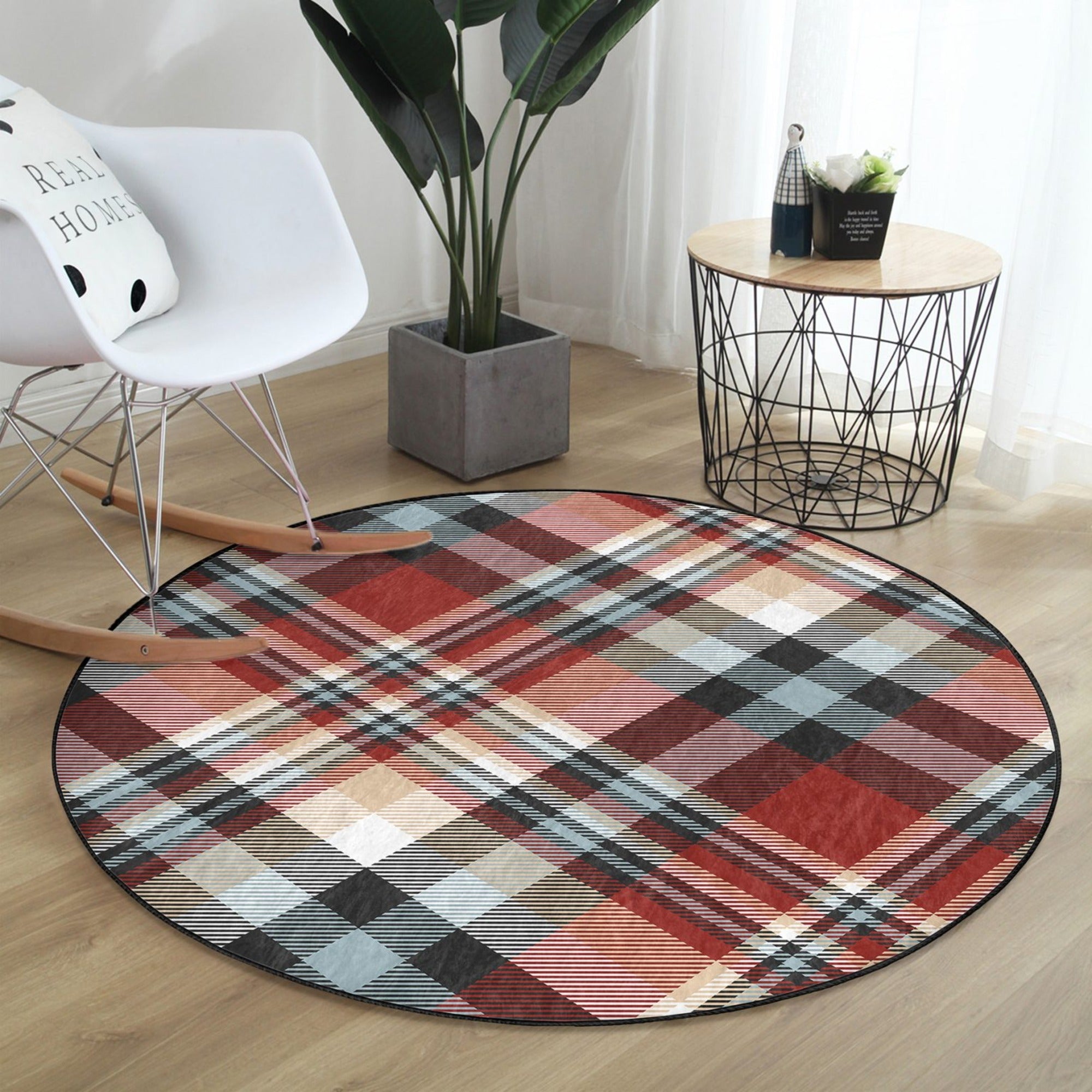 Plaid patterned round rug in a cozy living room setting, showcasing its soft velvet texture and non-slip backing.