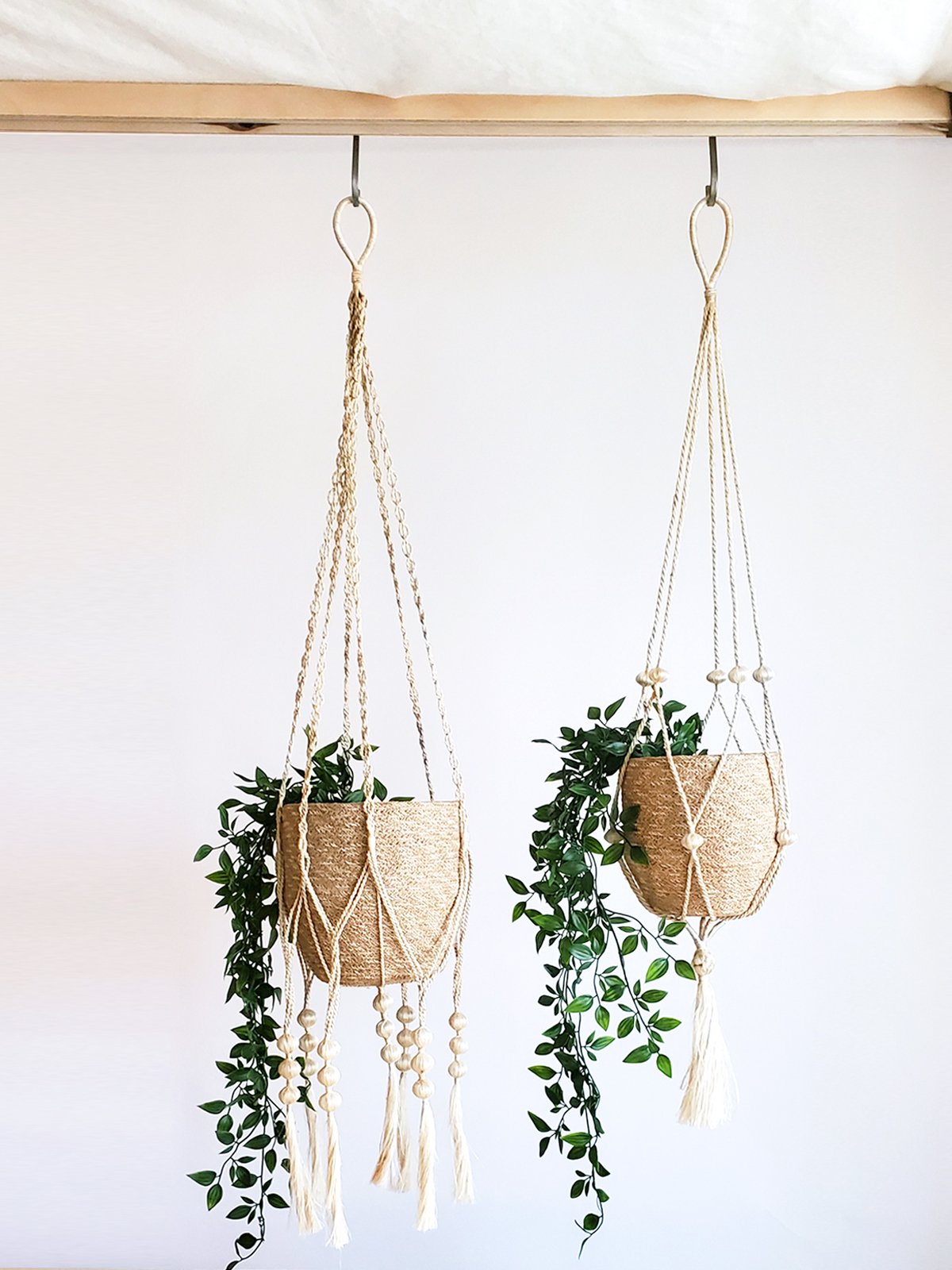 Fiora Plant Hanger made of natural braided jute, showcasing a knotted bottom for stability, perfect for indoor plants.