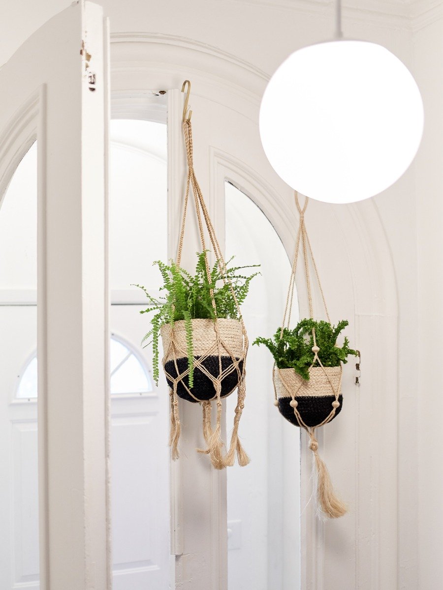 Handmade Nadu Plant Hanger made from natural jute, featuring a knotted bottom for potted plants, showcasing its rustic charm.