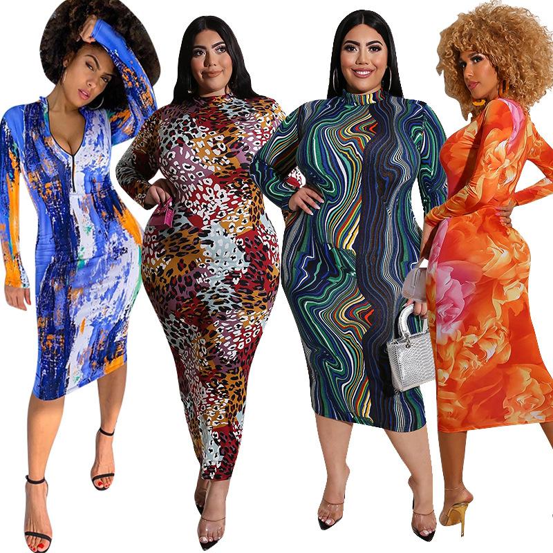 A stylish plus size oversized maxi dress featuring a vibrant print, flutter sleeves, and a flattering A-line silhouette, perfect for casual occasions.