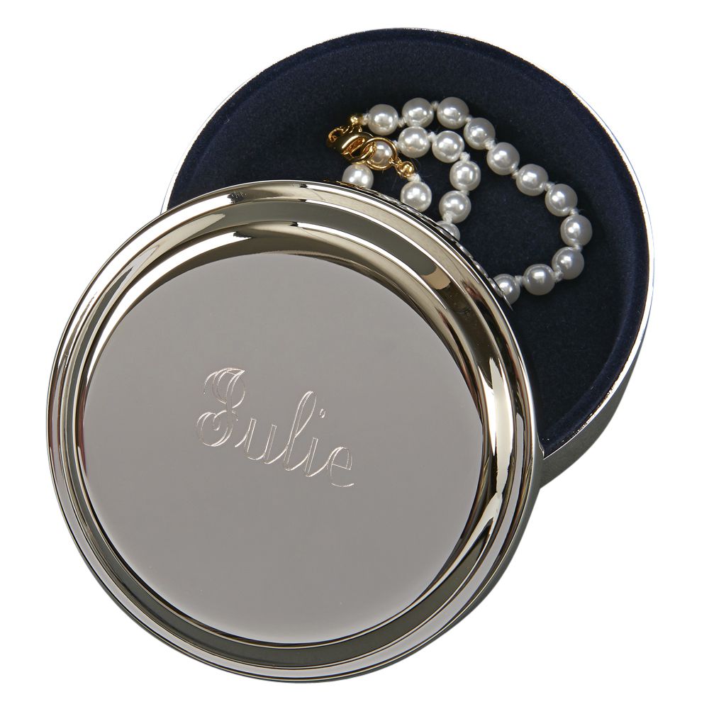 A polished round box with a shiny nickel-plated exterior and dark blue flocked interior, perfect for gifts and keepsakes.