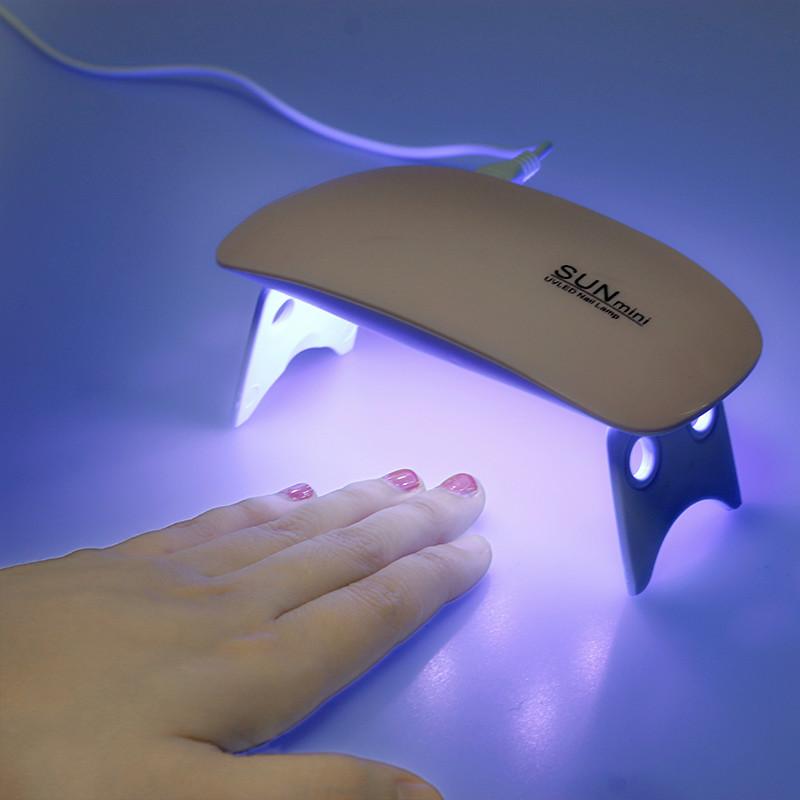 Portable Mini 6W LED Lamp Nail Dryer with USB charging, compact design, and timer settings for efficient nail drying.