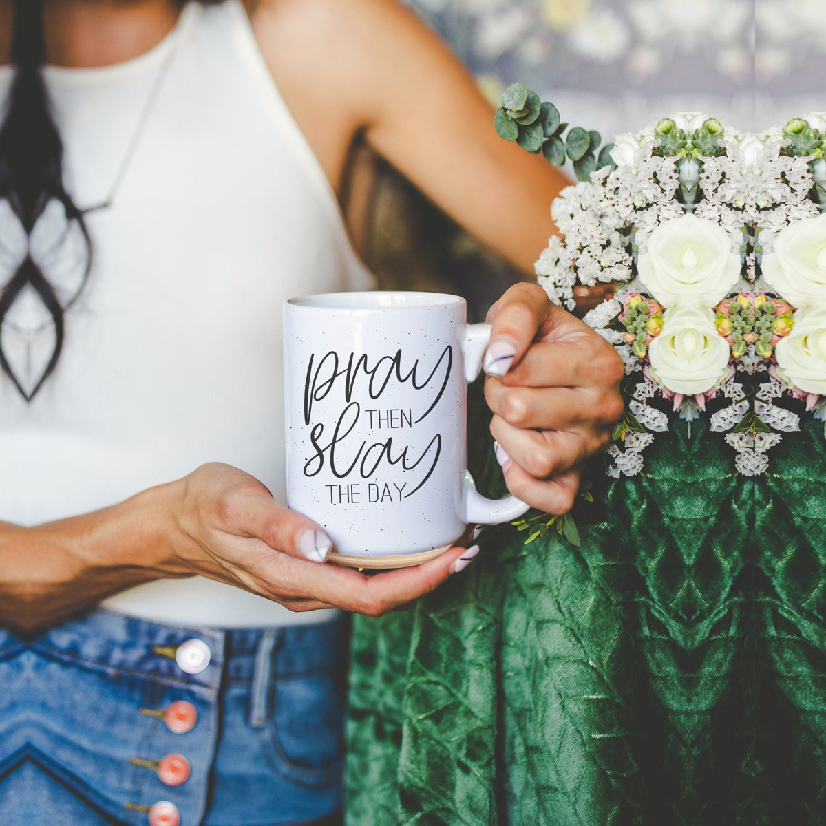 Pray + Slay 16oz ceramic mug with black graphic design on both sides, off-white color with dark speckles.