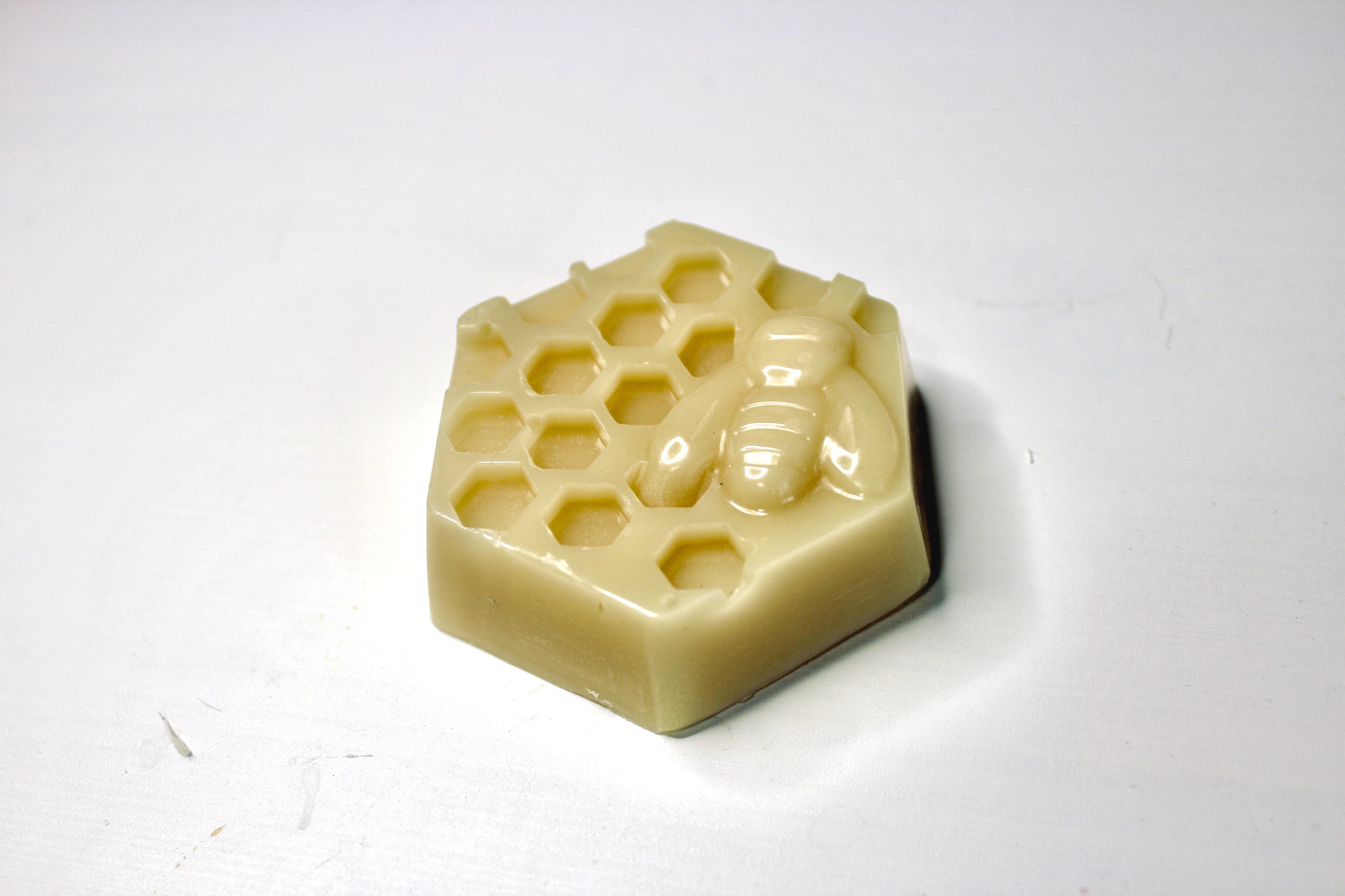 A Pre-mixed Wax Bar made of beeswax, pine resin, and jojoba oil, ideal for rejuvenating beeswax wraps or creating new ones.