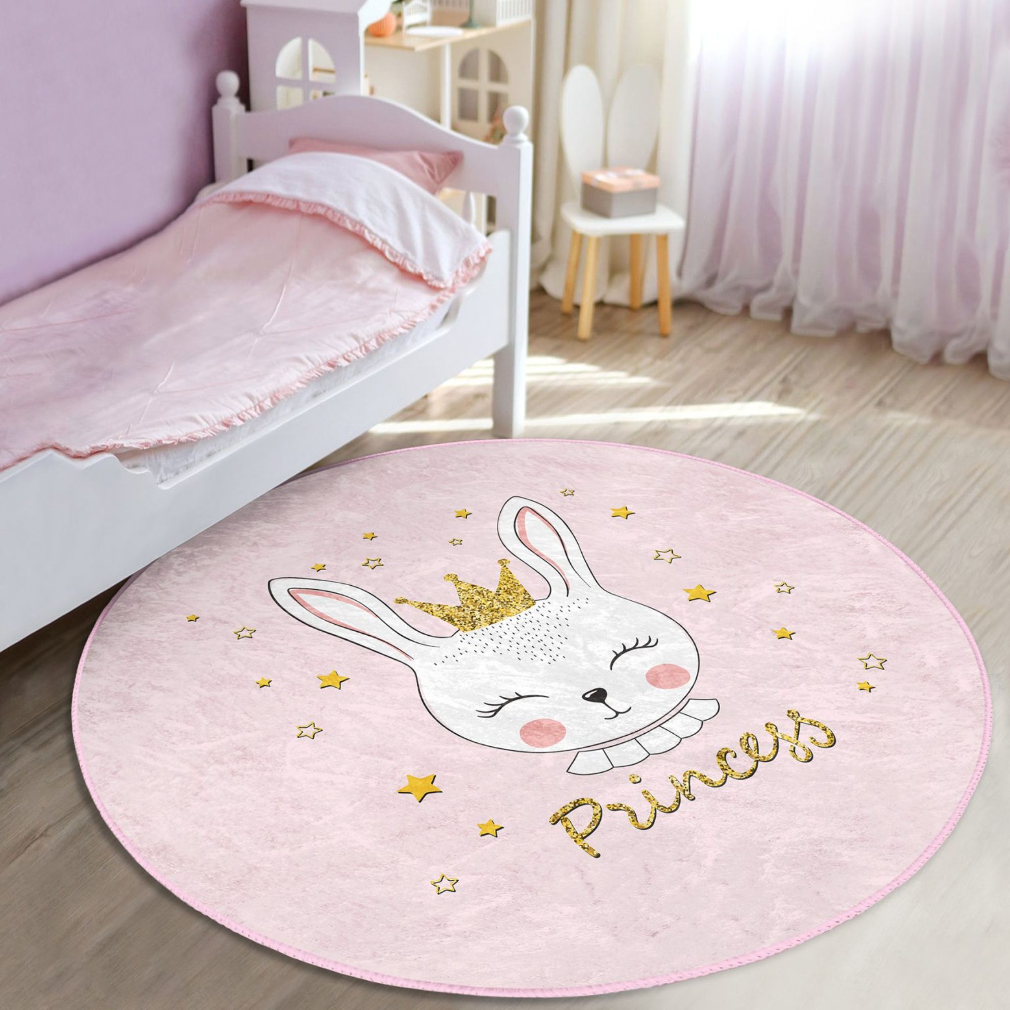 A pink washable rug featuring a cute princess rabbit pattern, perfect for kids' rooms, showcasing vibrant colors and soft texture.