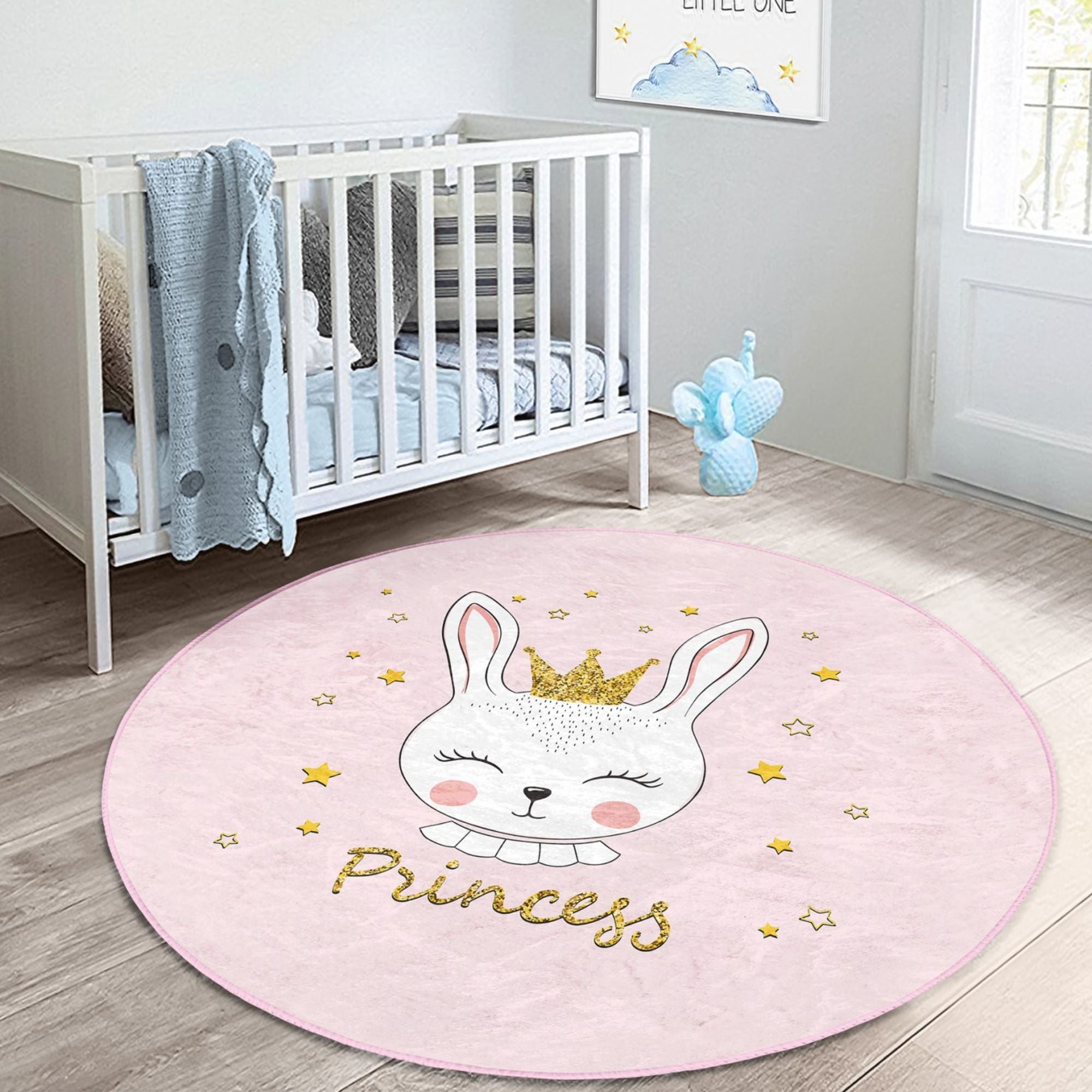 A pink washable rug featuring a cute princess rabbit pattern, perfect for kids' rooms, showcasing vibrant colors and soft texture.