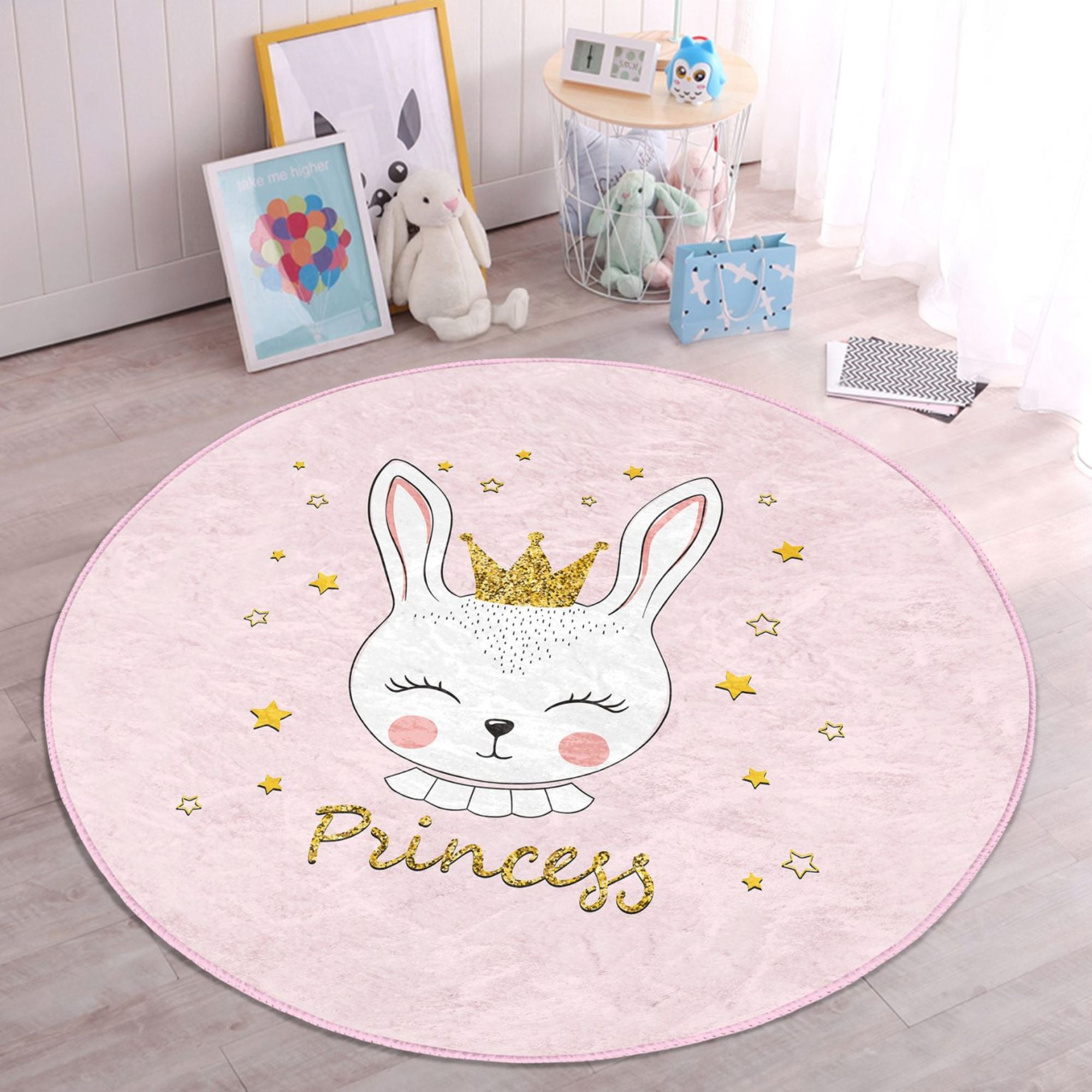 A pink washable rug featuring a cute princess rabbit pattern, perfect for kids' rooms, showcasing vibrant colors and soft texture.