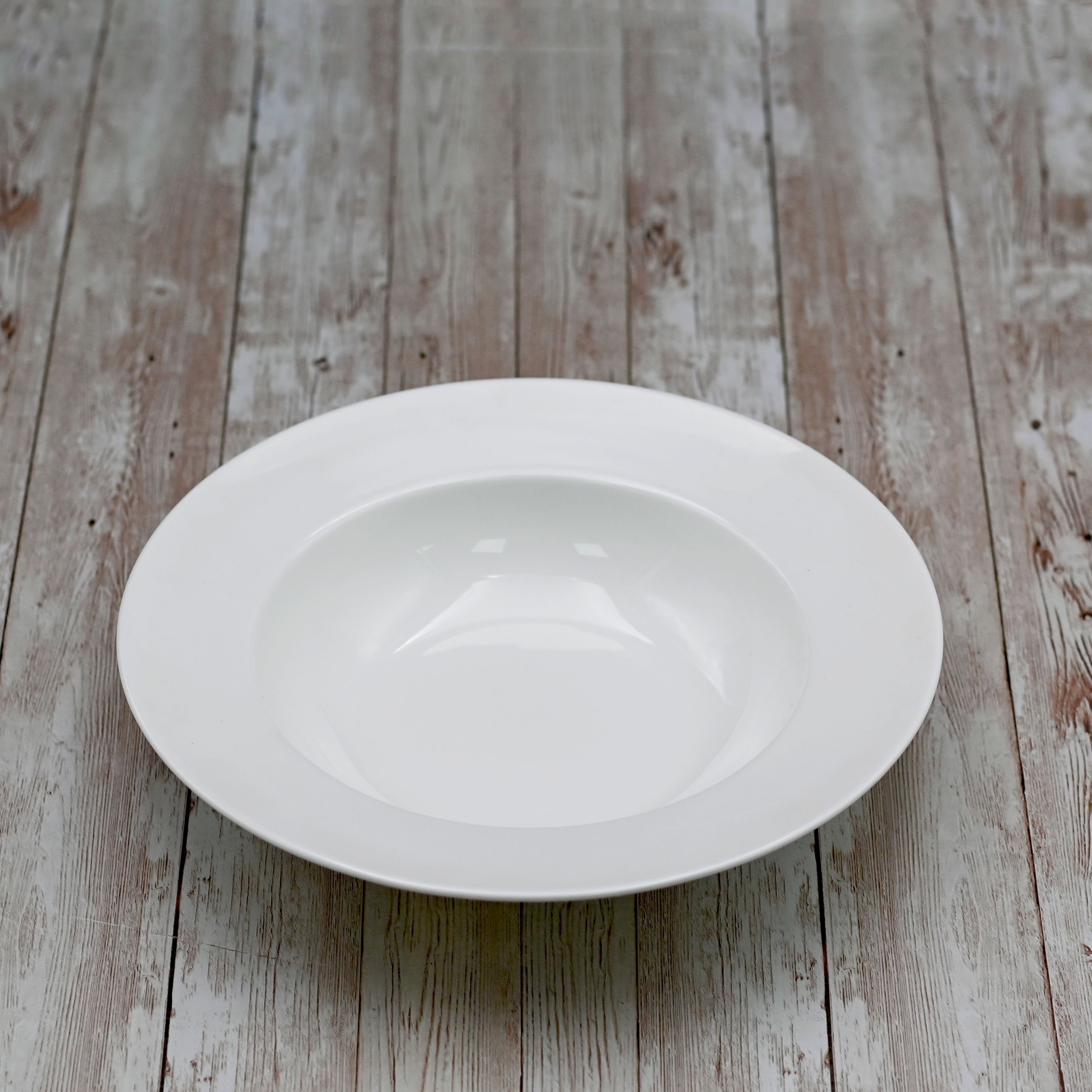 Professional Rolled Rim White Deep Plate, 10 inches, elegant porcelain design for serving soups and stews.