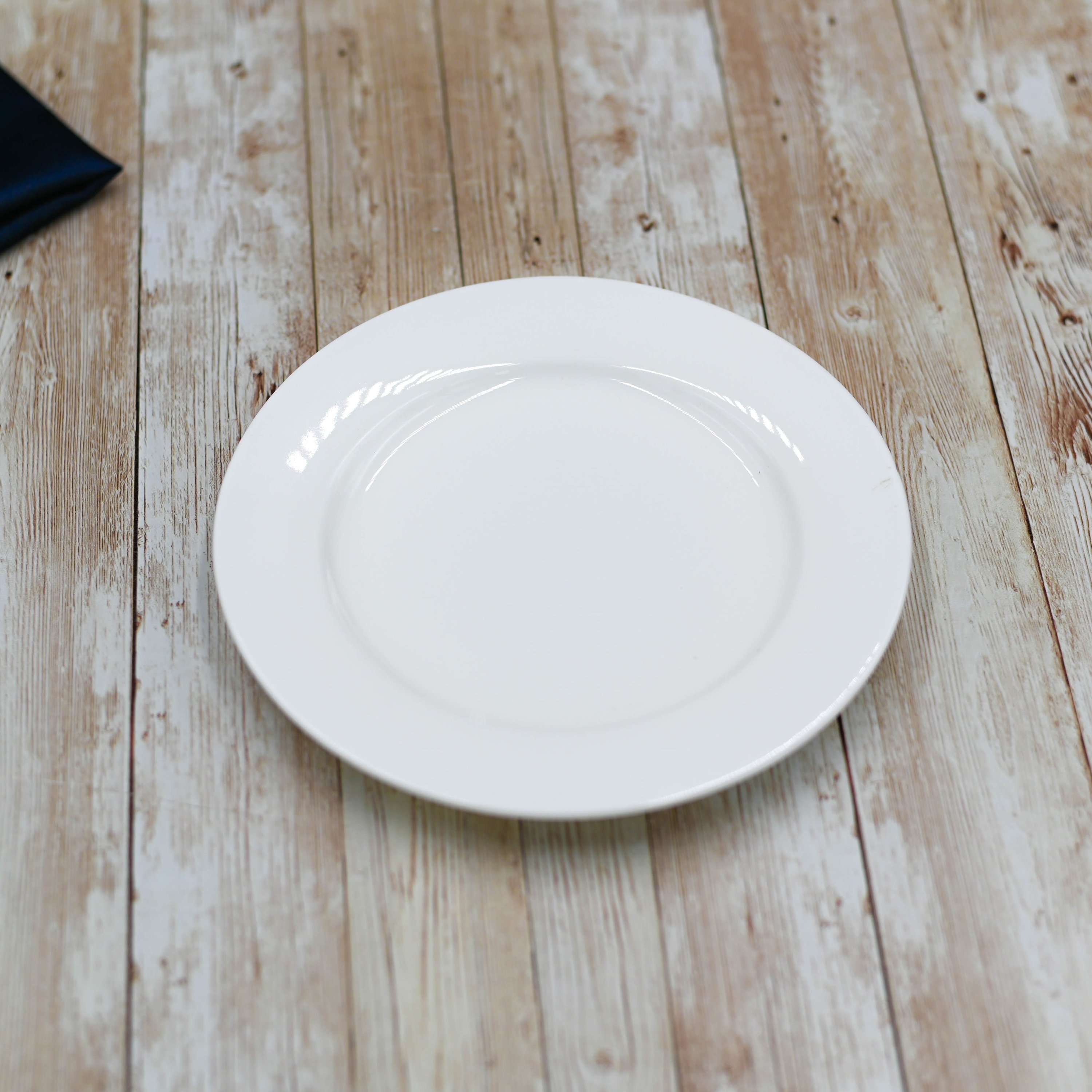 Professional Rolled Rim White Dessert Plate, 7 inches in diameter, showcasing its elegant design and smooth porcelain finish.