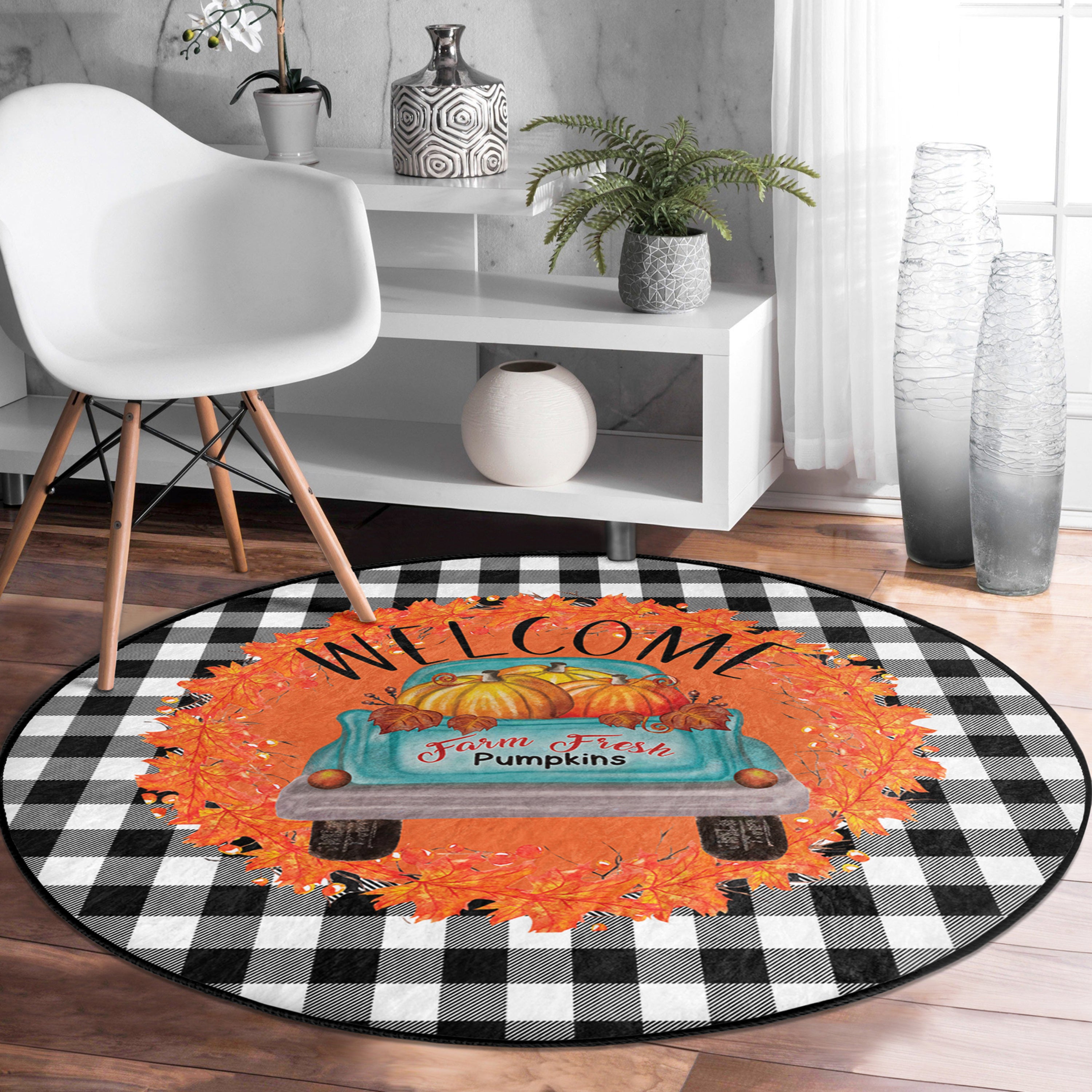 A vibrant round rug featuring a pumpkin farm truck design, showcasing bright colors and intricate details, perfect for fall decor.