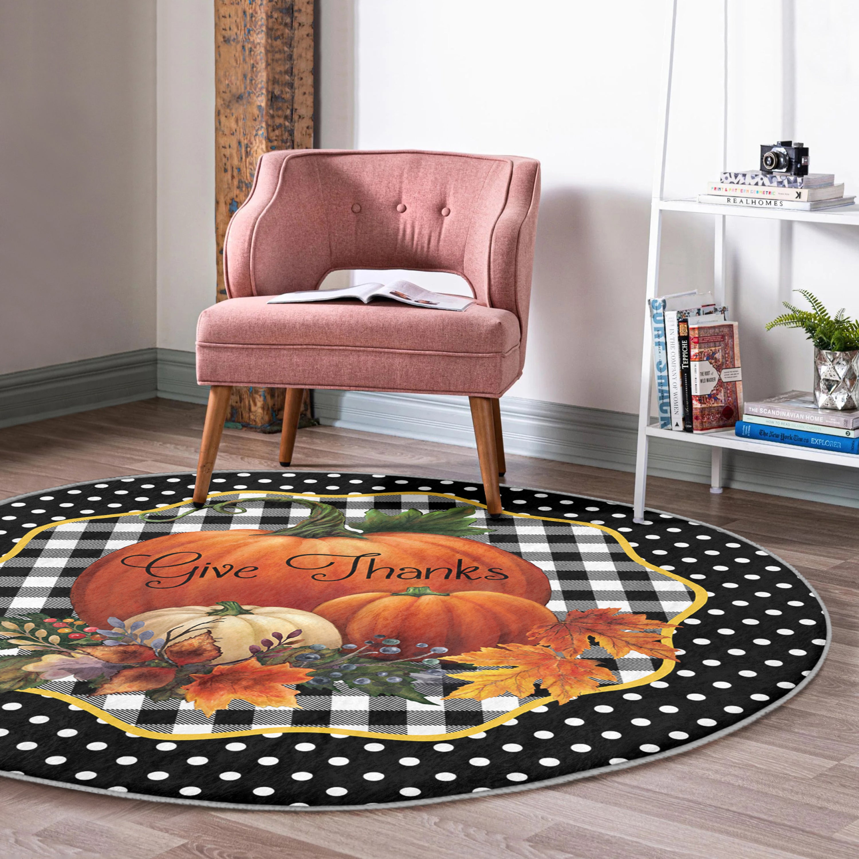 A round rug featuring a vibrant pumpkin pattern, made of soft velvet fabric, perfect for living room decor.