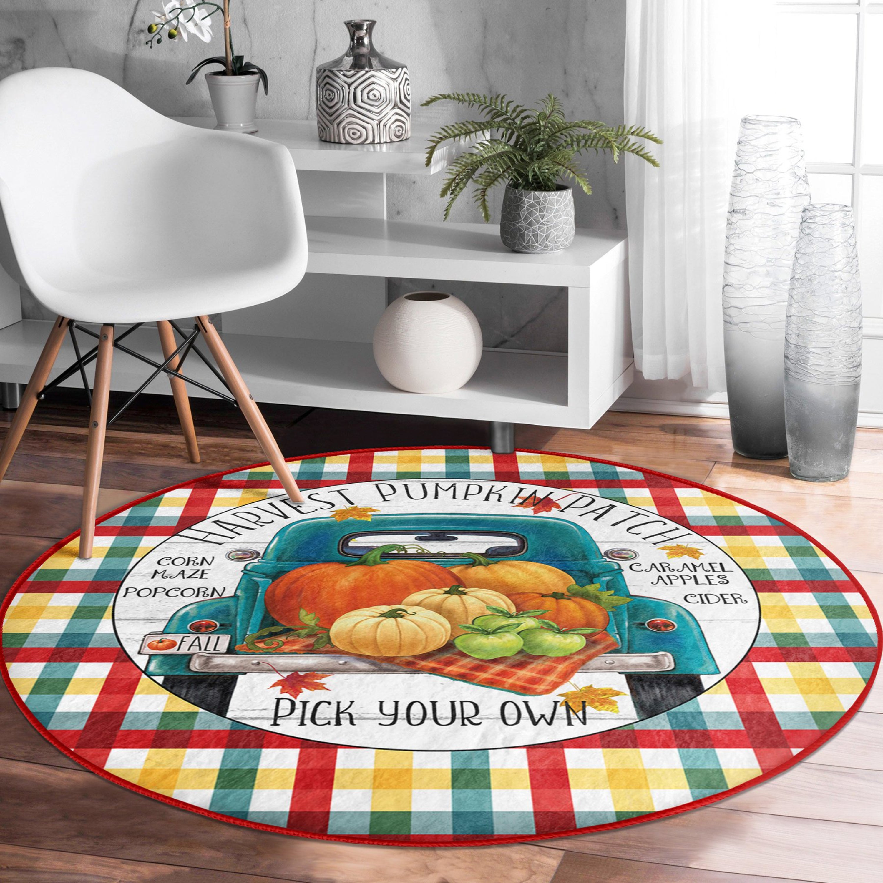 A round rug featuring a pumpkin truck pattern, showcasing vibrant autumn colors and soft velvet texture, perfect for seasonal home decor.