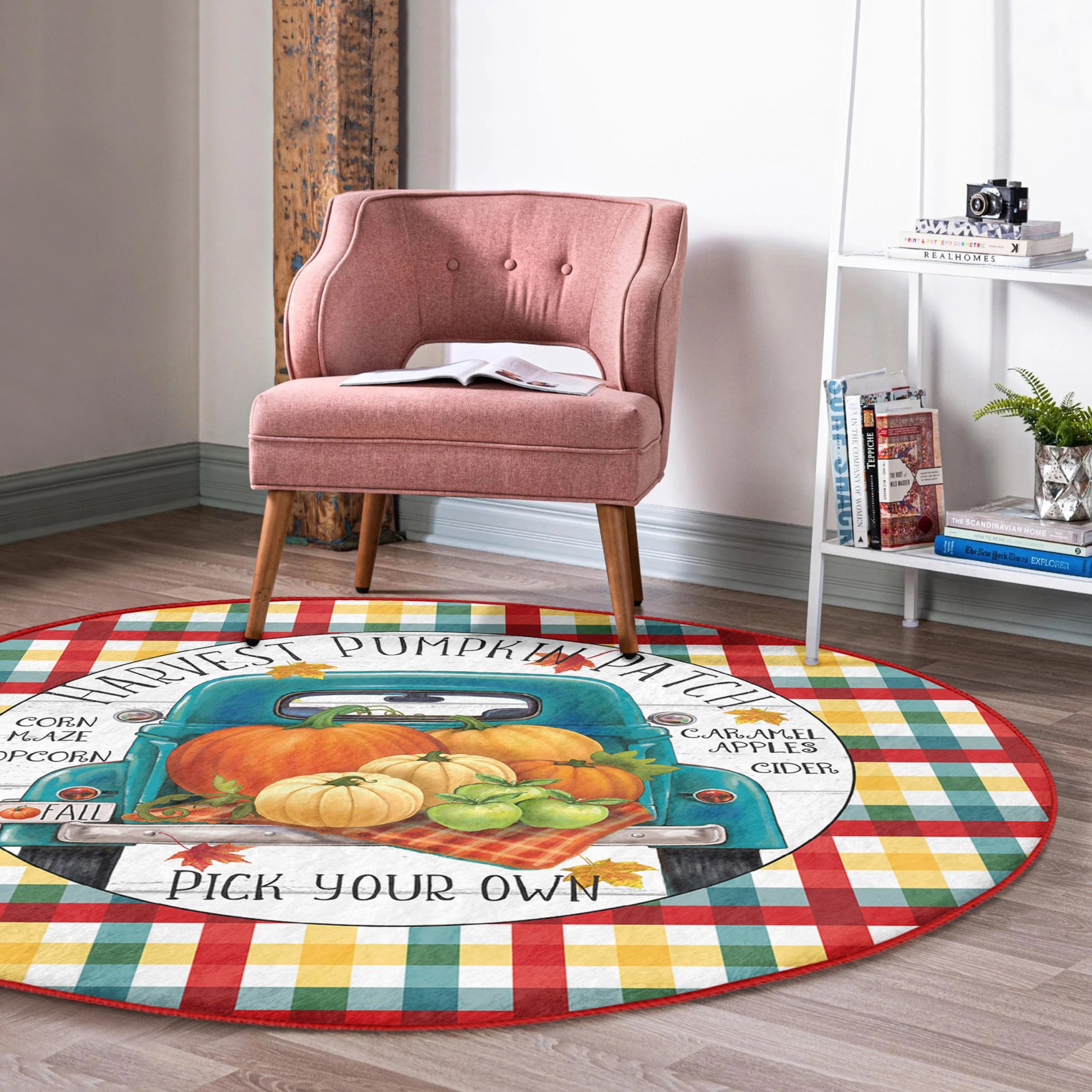 A round rug featuring a pumpkin truck pattern, showcasing vibrant autumn colors and soft velvet texture, perfect for seasonal home decor.