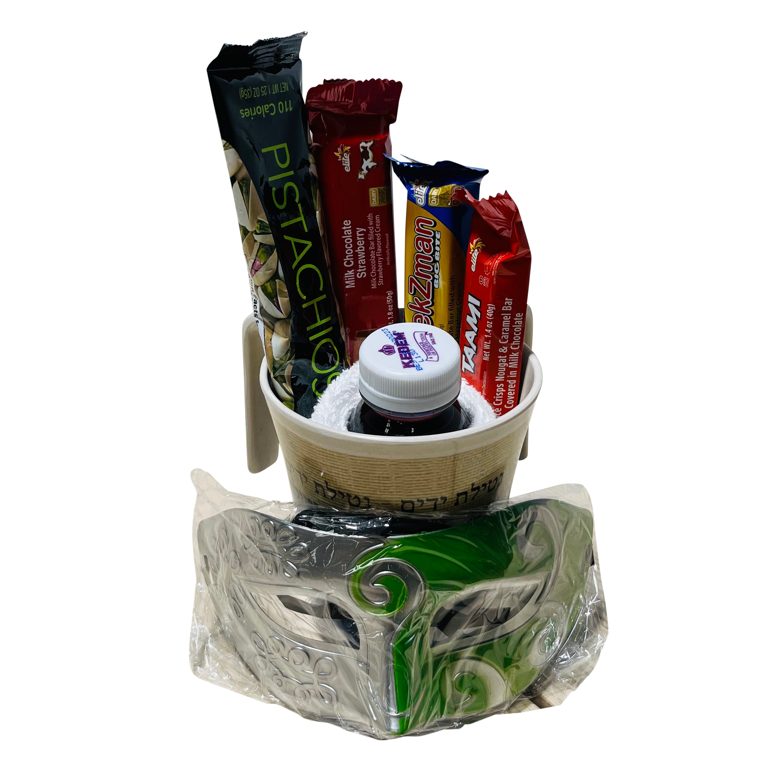 A beautifully arranged mishloach manot for Purim, featuring a bamboo washing cup, hand towel, grape juice, chocolate bars, pistachios, and a plastic mask.