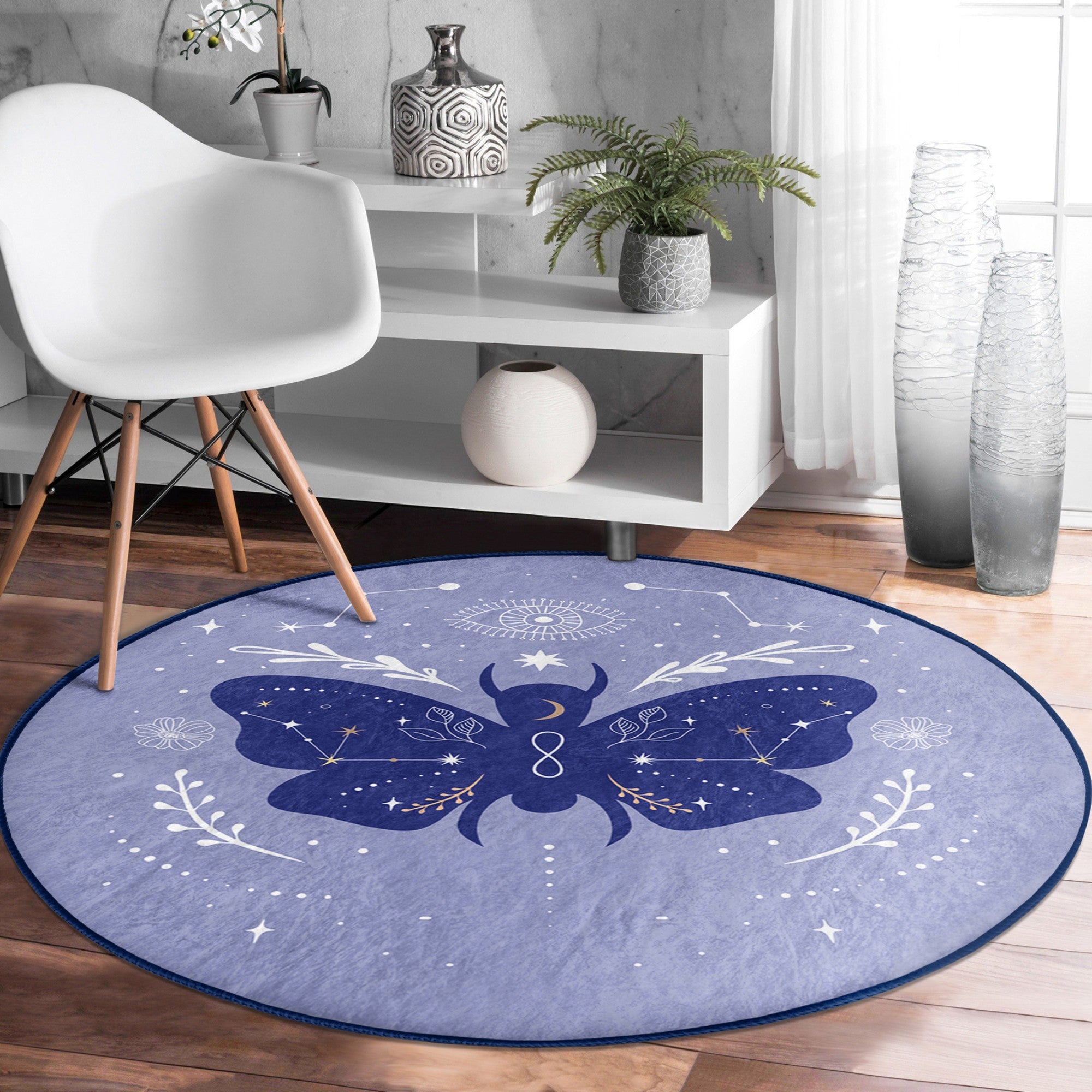 A round rug featuring a vibrant purple butterfly pattern, made of soft velvet fabric, perfect for boho home decor.