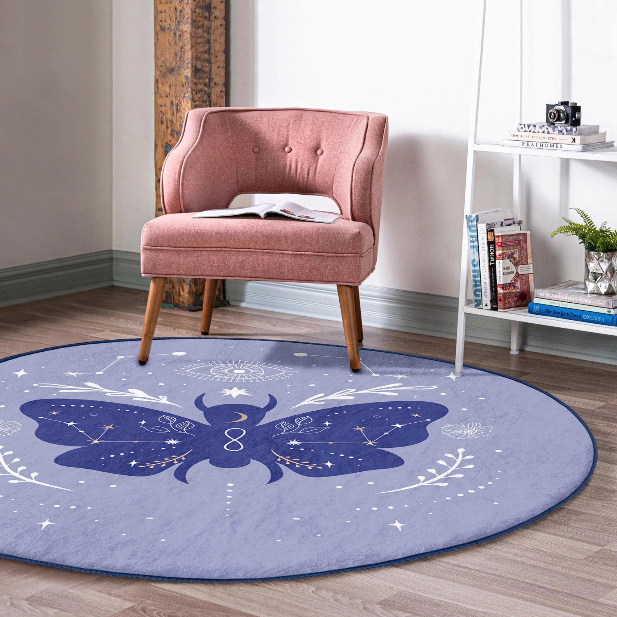 A round rug featuring a vibrant purple butterfly pattern, made of soft velvet fabric, perfect for boho home decor.