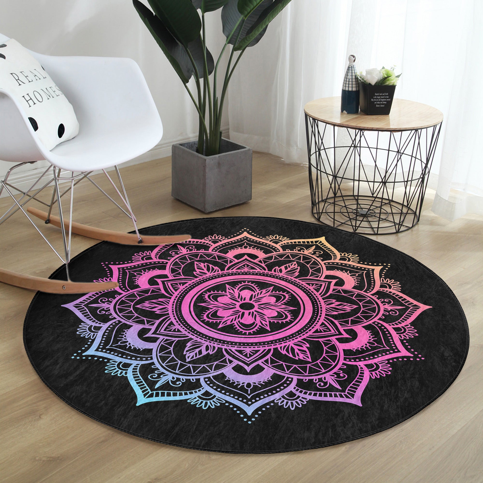 A round rug featuring a vibrant purple mandala design on a black background, showcasing its soft texture and intricate patterns.