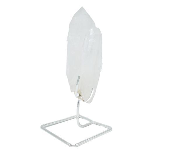 A beautiful quartz point displayed on a sturdy wire stand, available in gold and silver finishes, enhancing home decor.