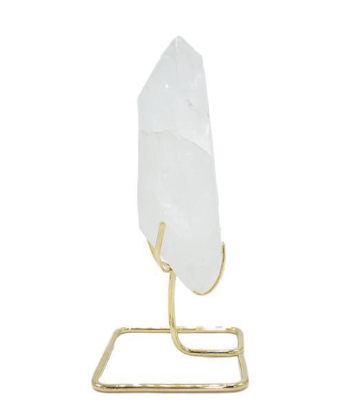 A beautiful quartz point displayed on a sturdy wire stand, available in gold and silver finishes, enhancing home decor.