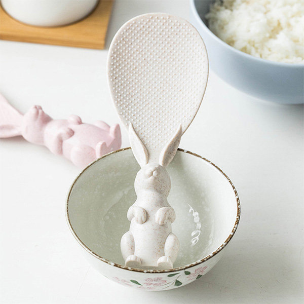 Rabbit-shaped spoon in bowl.