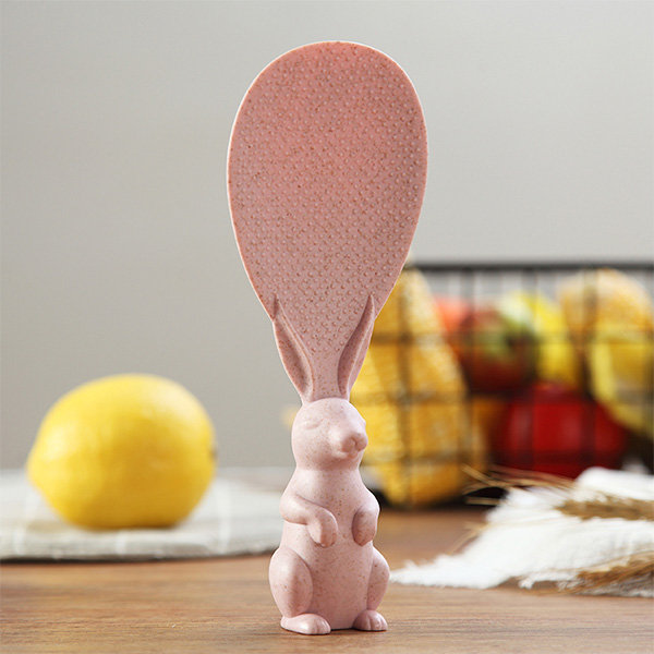 Pink rabbit-shaped kitchen spoon holder.