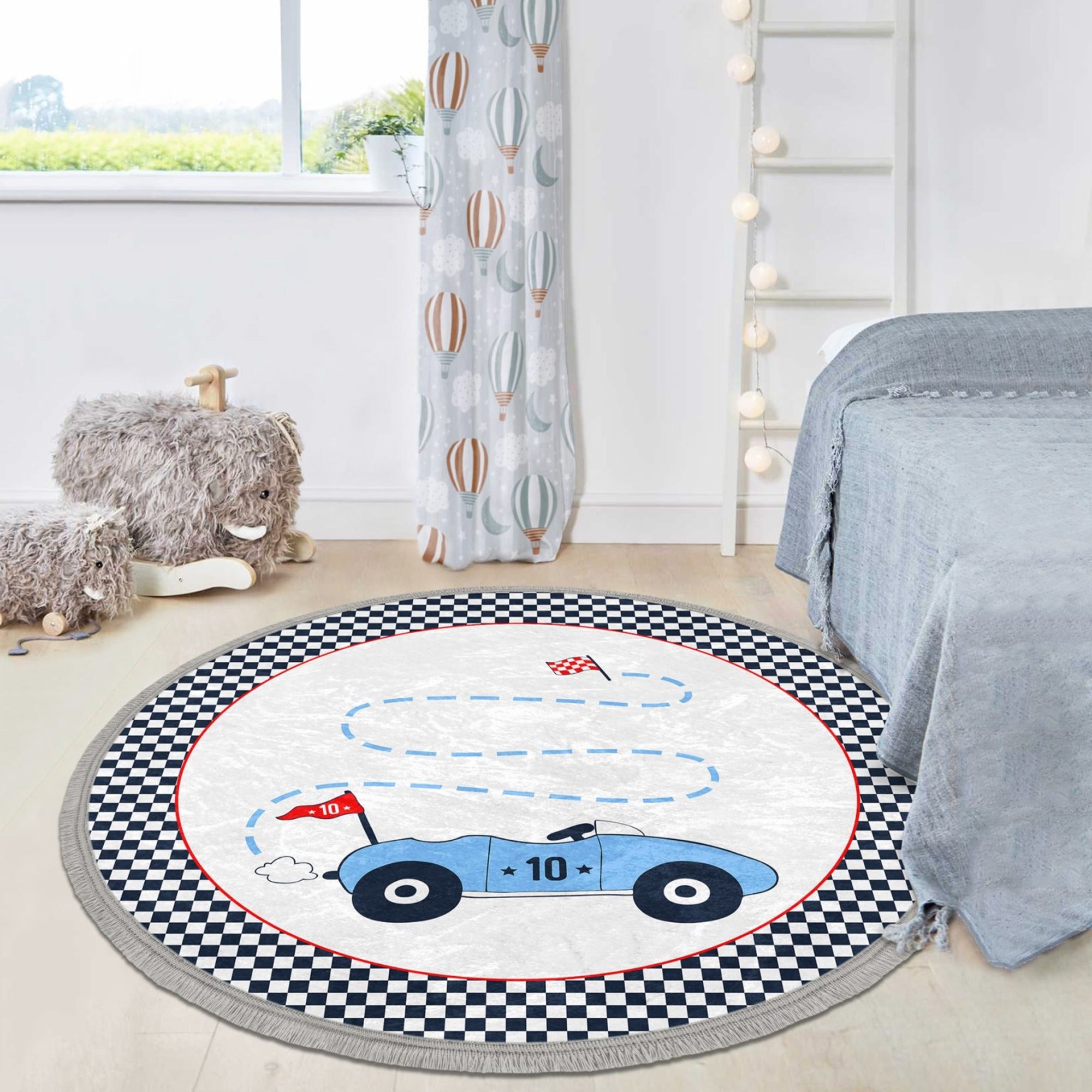 Colorful race car printed round area rug for kids' room, featuring a soft velvet texture and nonslip backing.