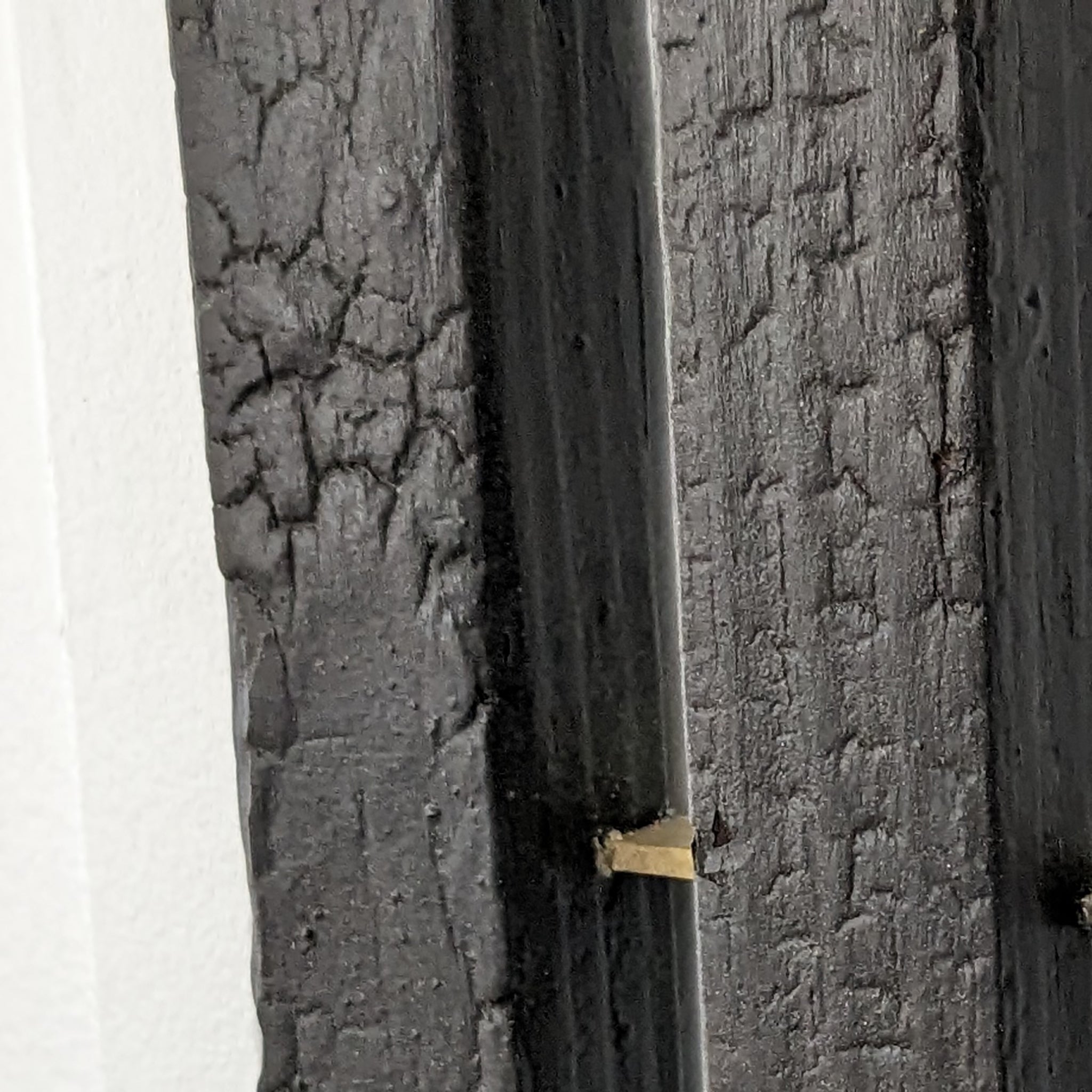 Rack On coat rack featuring hooks and a brass tray, made from reclaimed wood with a torched black finish.