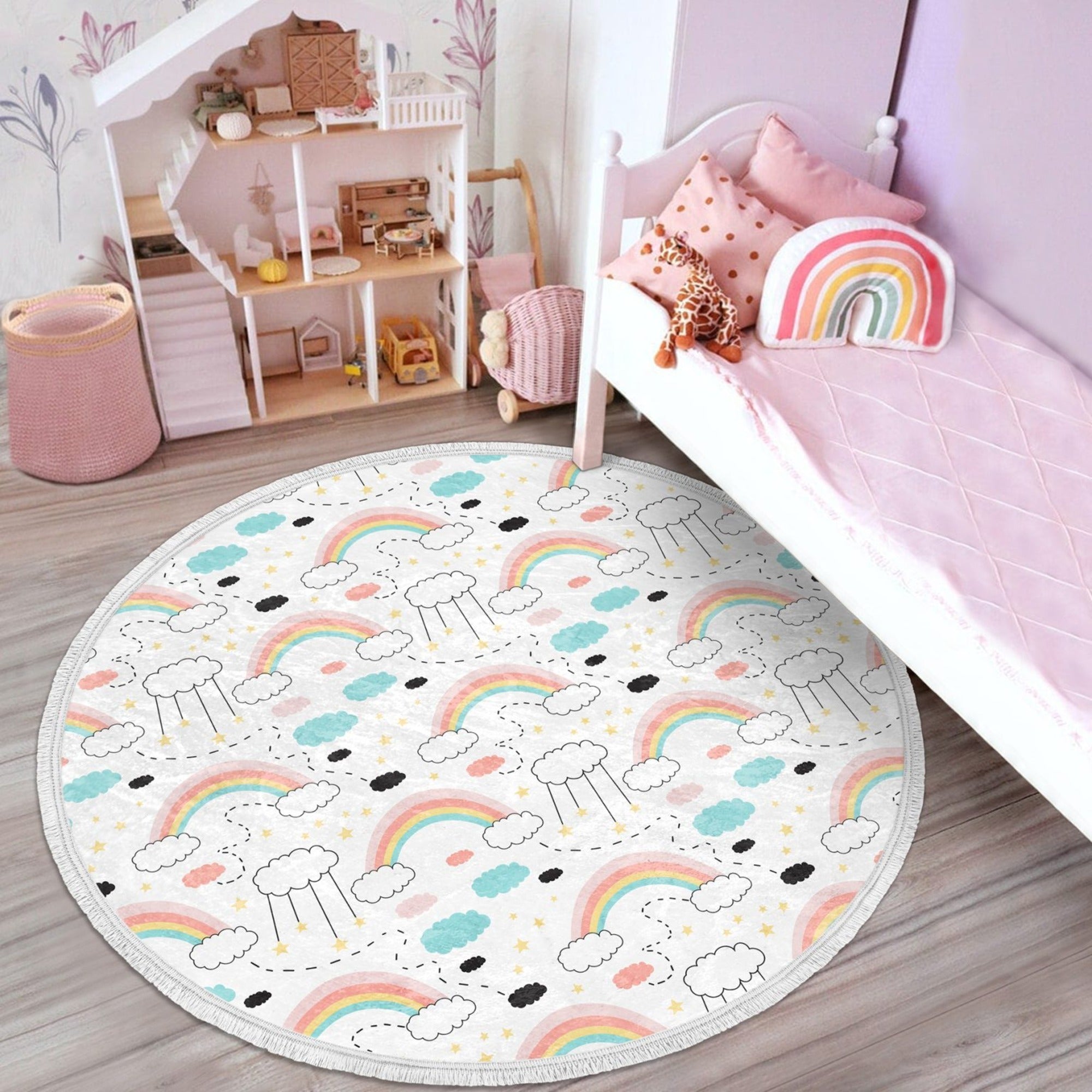 A colorful round nursery area rug featuring a vibrant rainbow pattern, designed for kids' rooms with a non-slip backing.