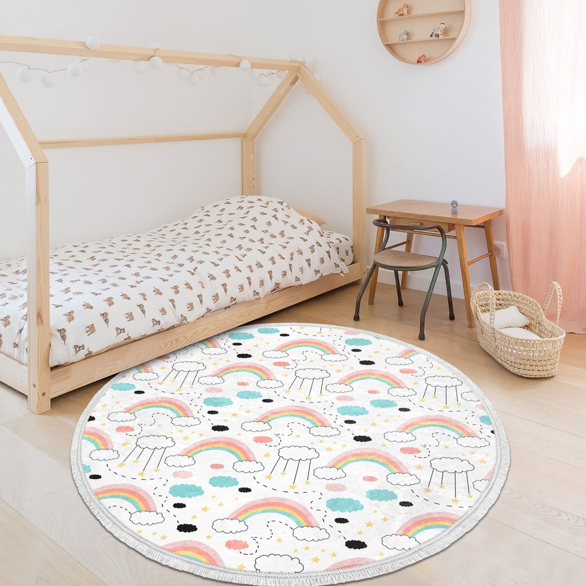 A colorful round nursery area rug featuring a vibrant rainbow pattern, designed for kids' rooms with a non-slip backing.