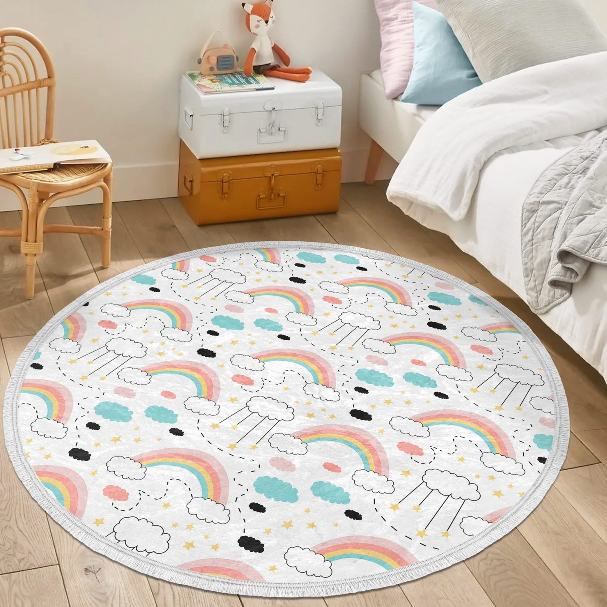 A colorful round nursery area rug featuring a vibrant rainbow pattern, designed for kids' rooms with a non-slip backing.