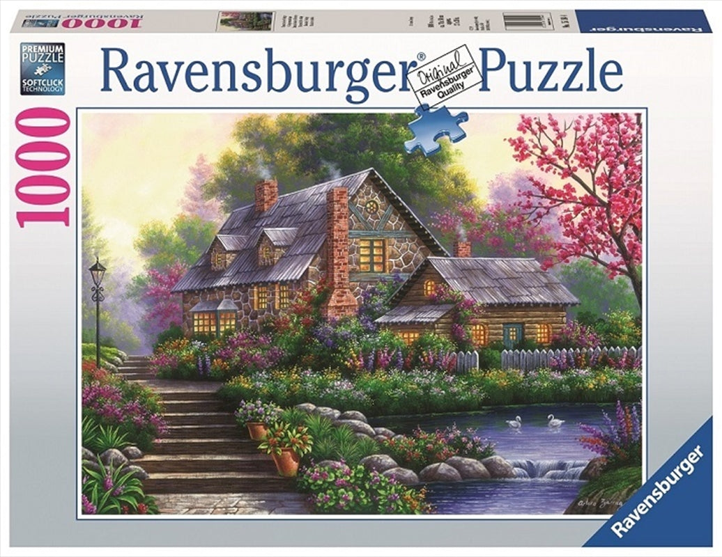 Ravensburger 1000pc Romantic Cottage Jigsaw Puzzle featuring a charming cottage surrounded by flowers and greenery.