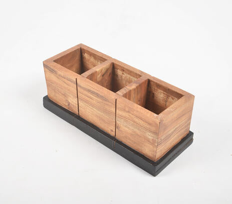 A beautifully crafted raw wooden pen stand with three slots, showcasing natural wood texture and irregularities, perfect for organizing stationery.