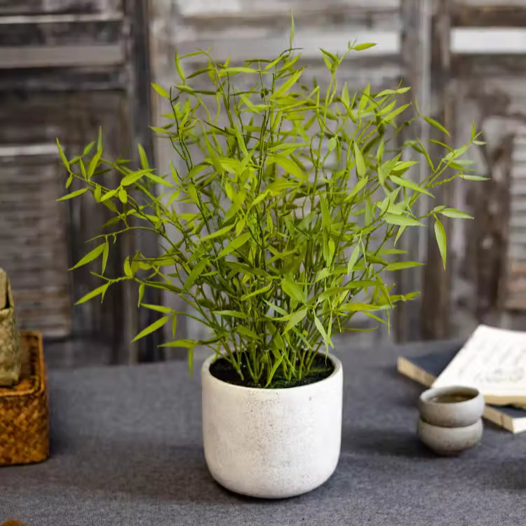 Realistic Mini Bamboo Leaf Potted Plant in a light gray pot, showcasing vibrant green leaves and a lifelike appearance.