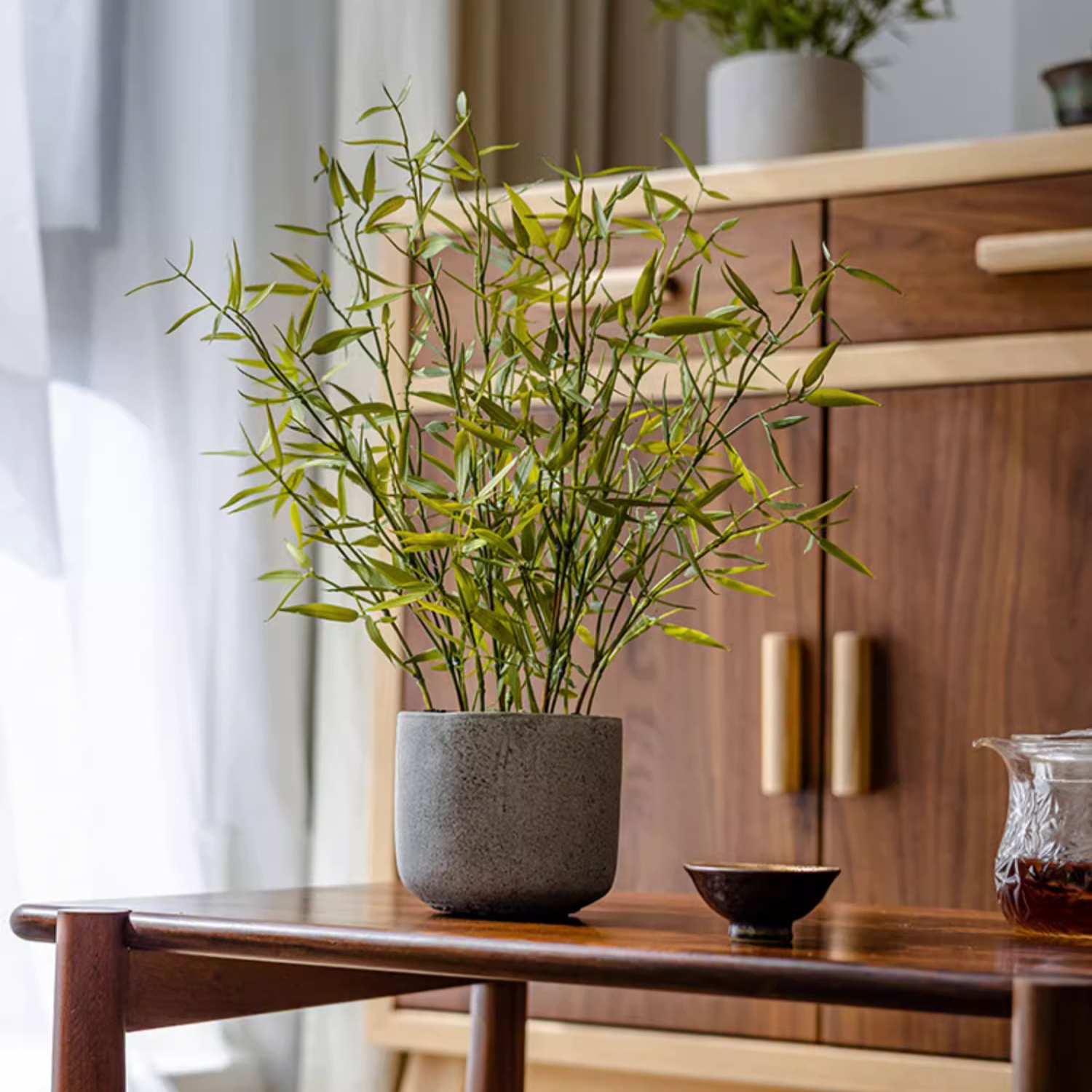 Realistic Mini Bamboo Leaf Potted Plant in a light gray pot, showcasing vibrant green leaves and a lifelike appearance.