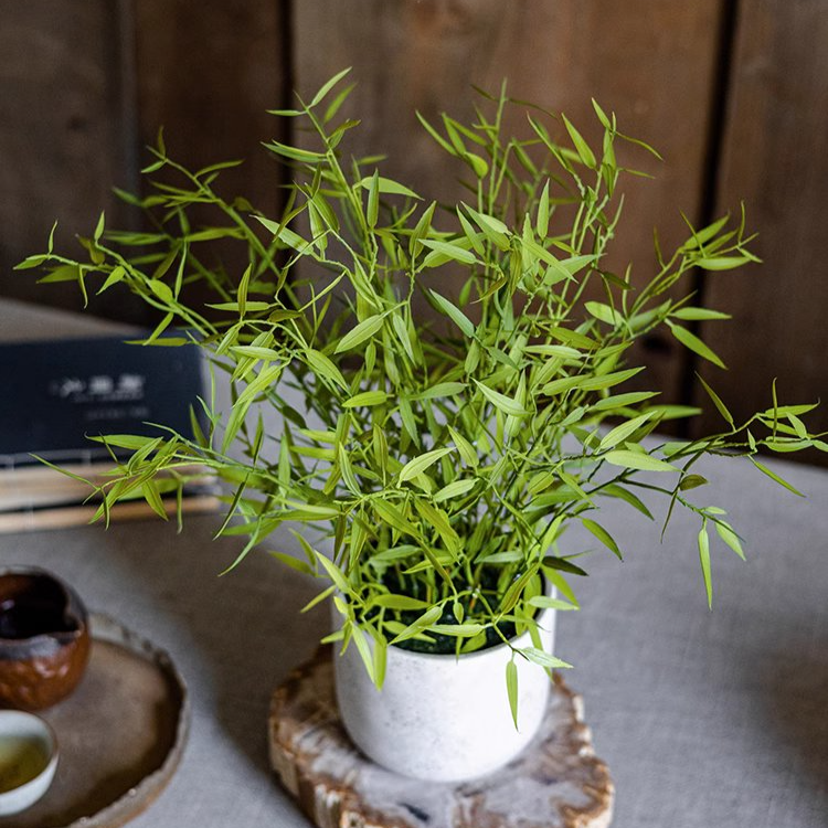 Realistic Mini Bamboo Leaf Potted Plant in a light gray pot, showcasing vibrant green leaves and a lifelike appearance.