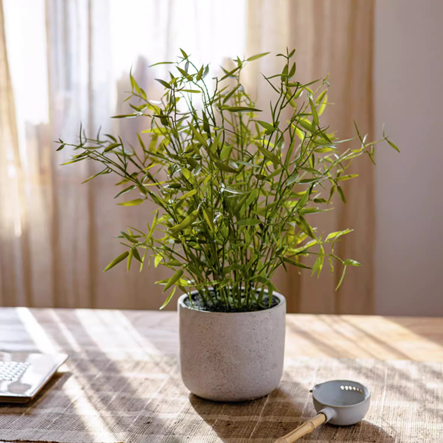 Realistic Mini Bamboo Leaf Potted Plant in a light gray pot, showcasing vibrant green leaves and a lifelike appearance.