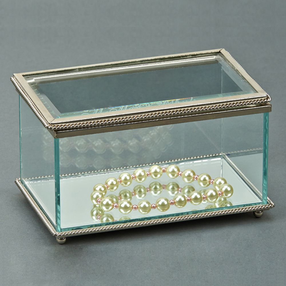 Elegant rectangular glass box with hinged cover and braided border, featuring a mirror bottom and four ball feet.