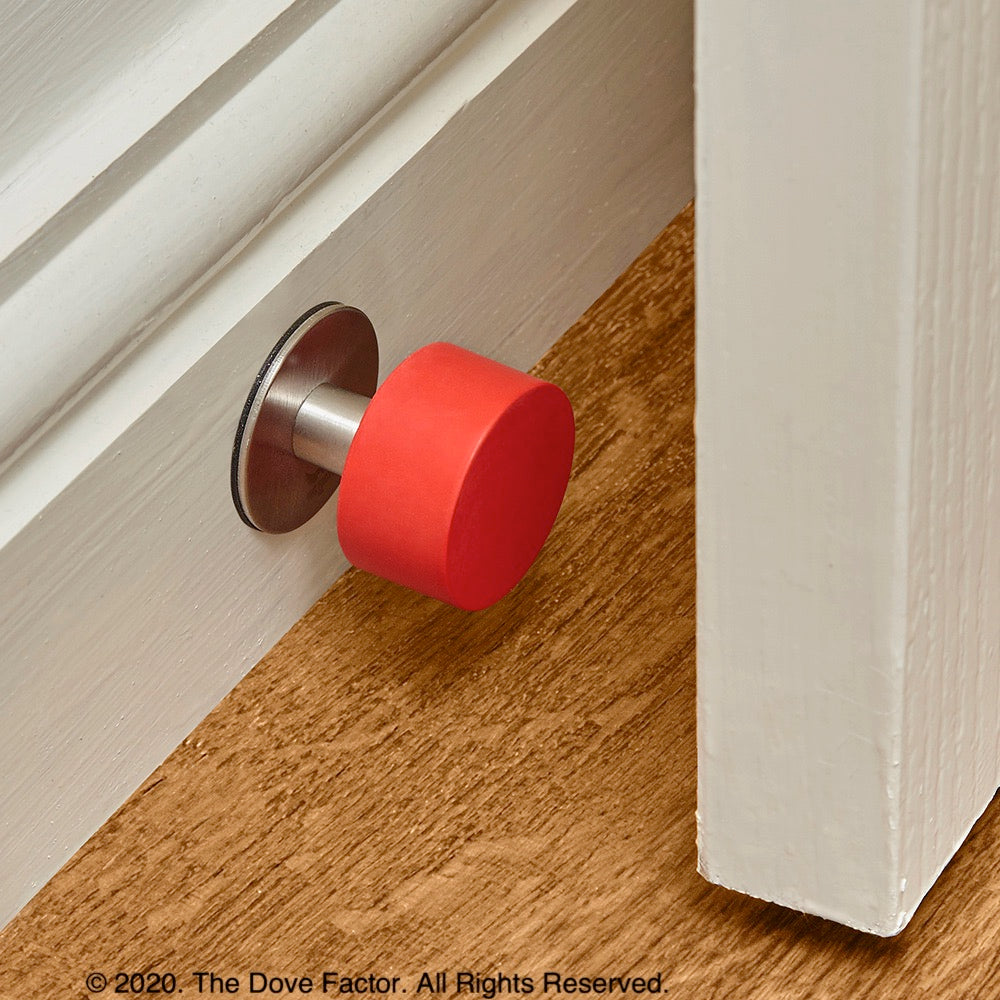 Red Door Stop with 3M Adhesive by The Dove Factor, showcasing its sleek stainless steel design and rubber cushioning.