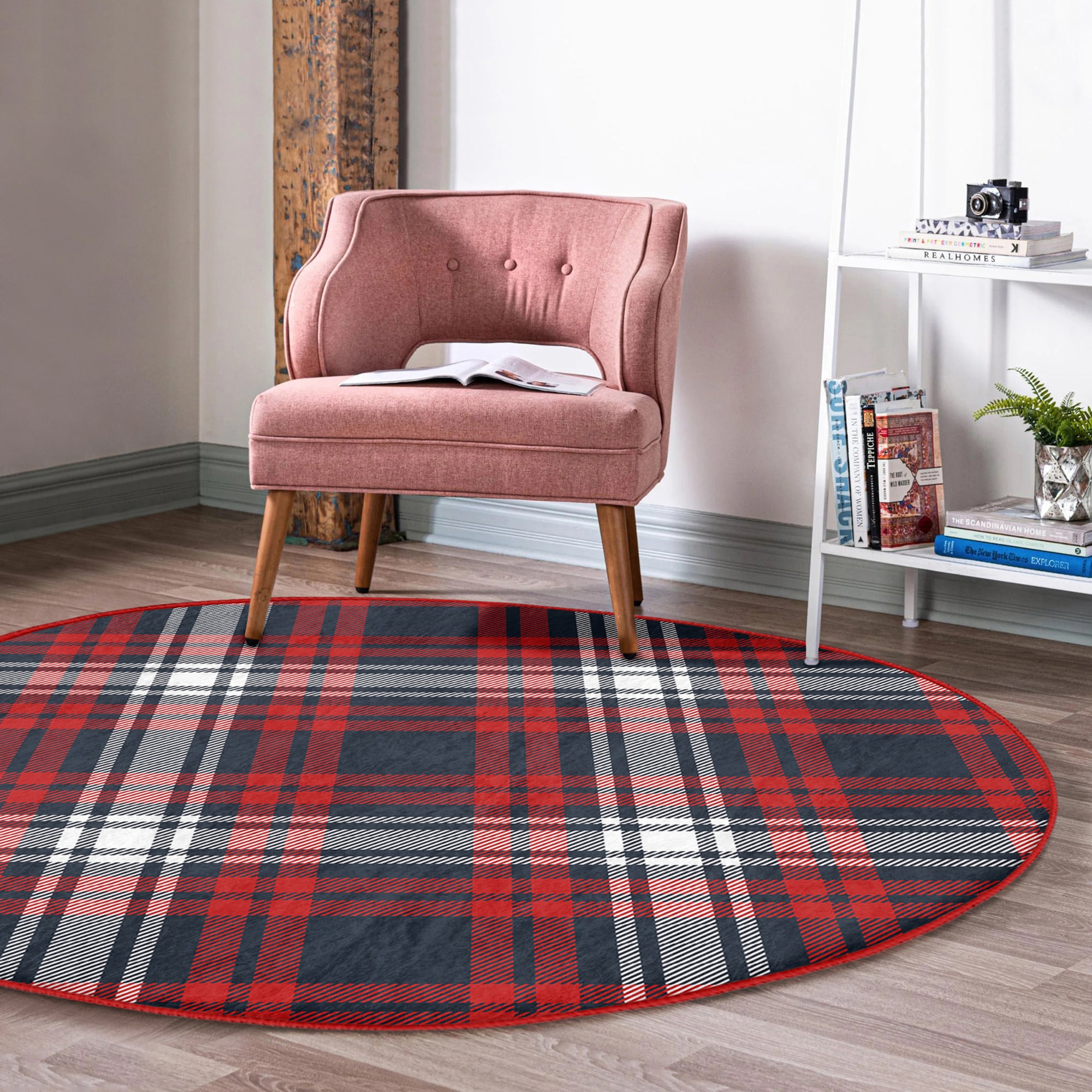 A cozy round rug featuring a vibrant red plaid pattern, perfect for home decoration.