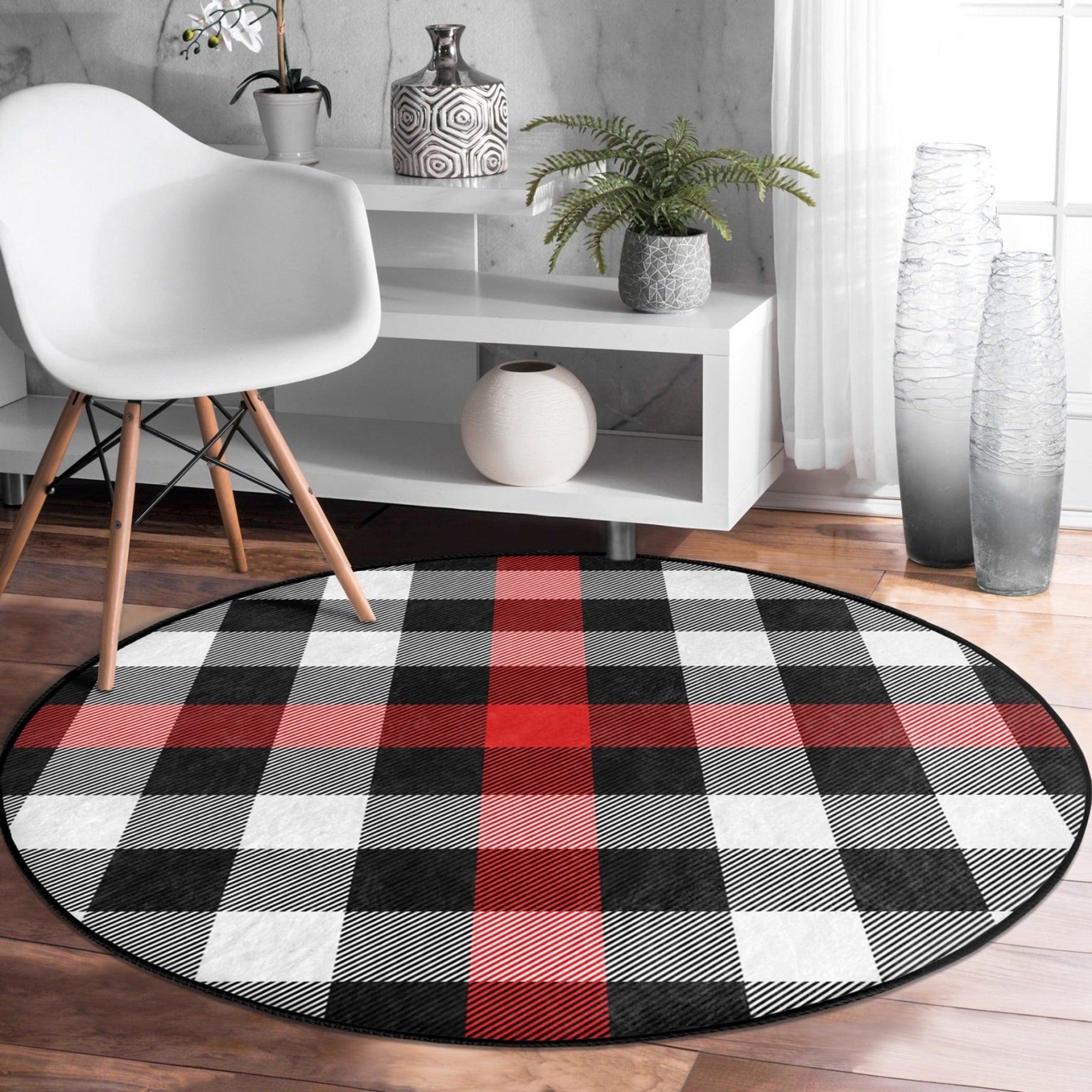 Red-grey plaid round rug, soft velvet fabric, stylish home decor accent.