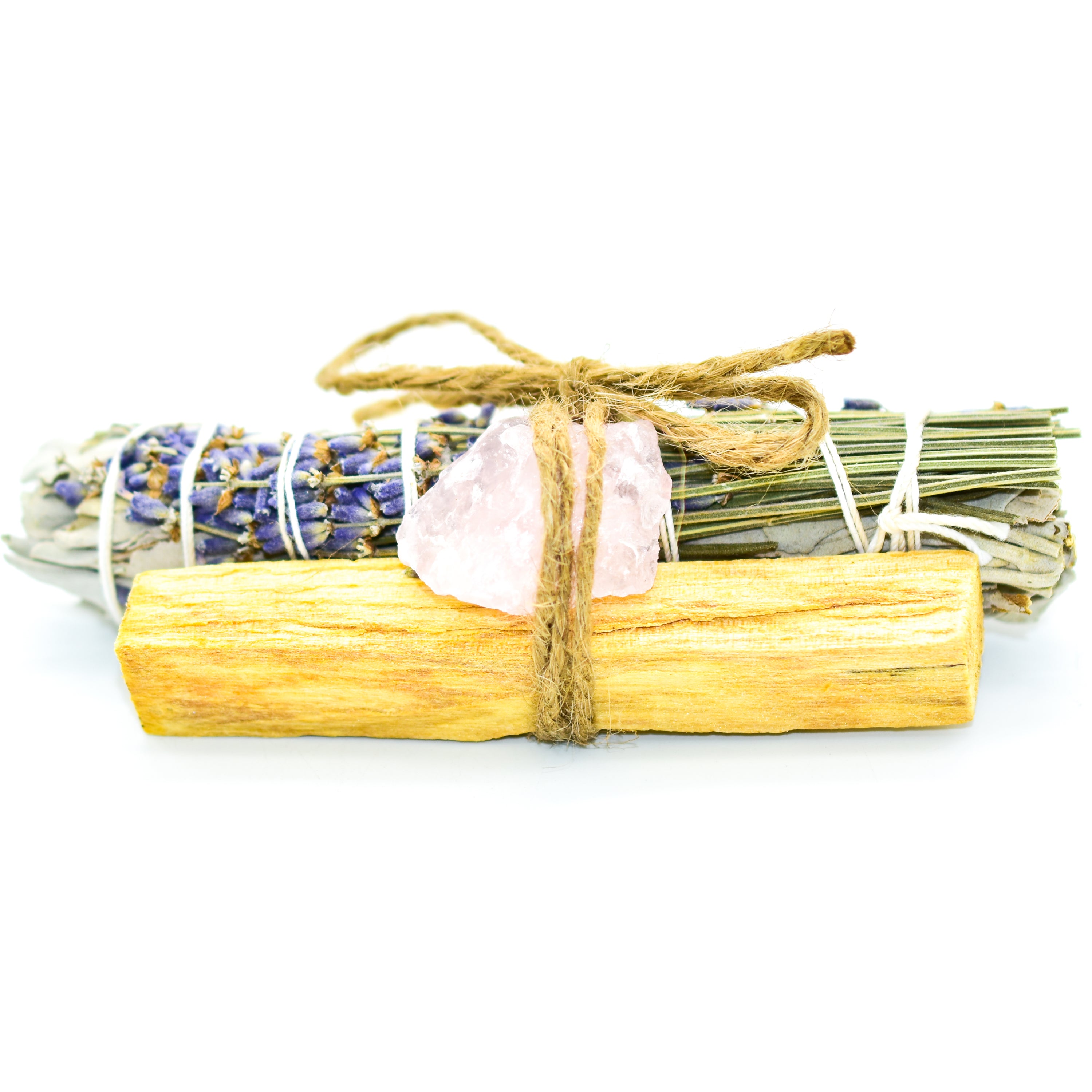 A beautifully arranged Relaxation Bundle featuring lavender and sage bundles alongside a rose quartz stone, all handmade in the USA.