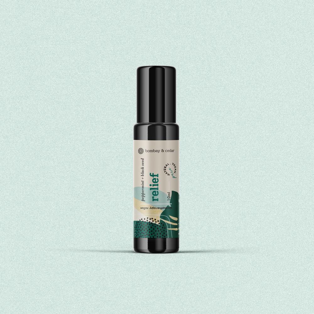 Relief Essential Oil Blend Roll-on in a 10ml biophotonic glass bottle with a glass roller ball, designed for soothing sore muscles.