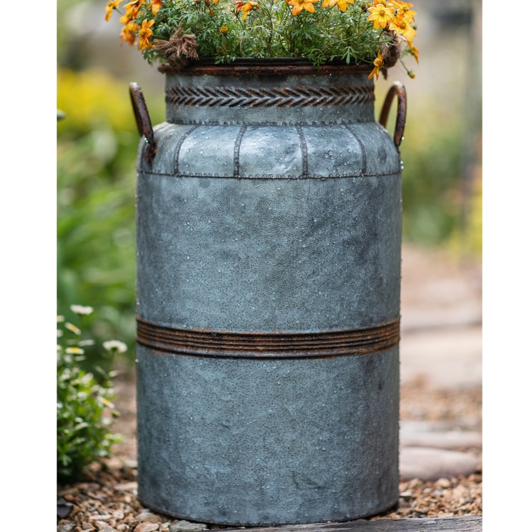 Restoration Flower Pot in gray-brown metal, showcasing its rustic design and durable construction, perfect for indoor and outdoor plants.