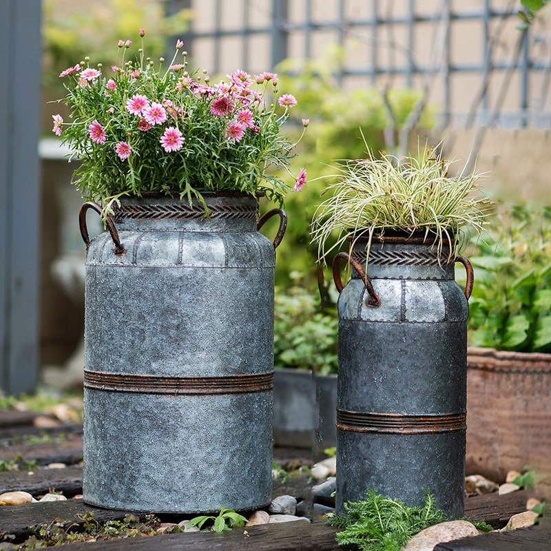 Restoration Flower Pot in gray-brown metal, showcasing its rustic design and durable construction, perfect for indoor and outdoor plants.