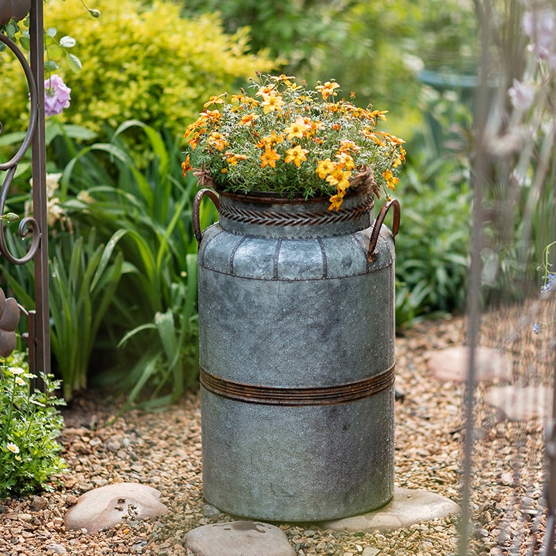 Restoration Flower Pot in gray-brown metal, showcasing its rustic design and durable construction, perfect for indoor and outdoor plants.