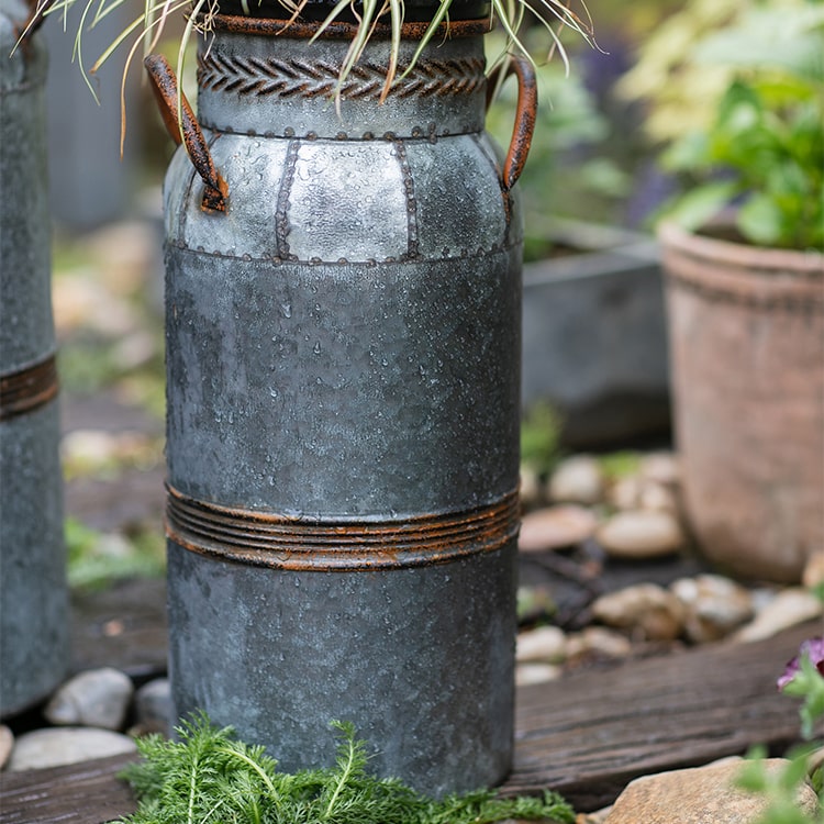 Restoration Flower Pot in gray-brown metal, showcasing its rustic design and durable construction, perfect for indoor and outdoor plants.